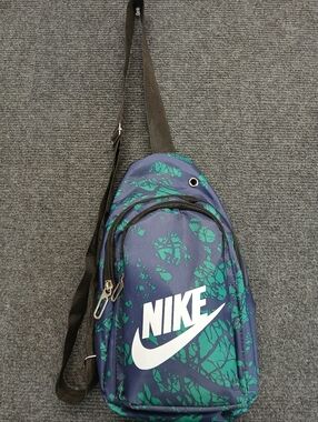Nike Navy Blue and Teal Graphic Sling Bag with Adjustable Strap